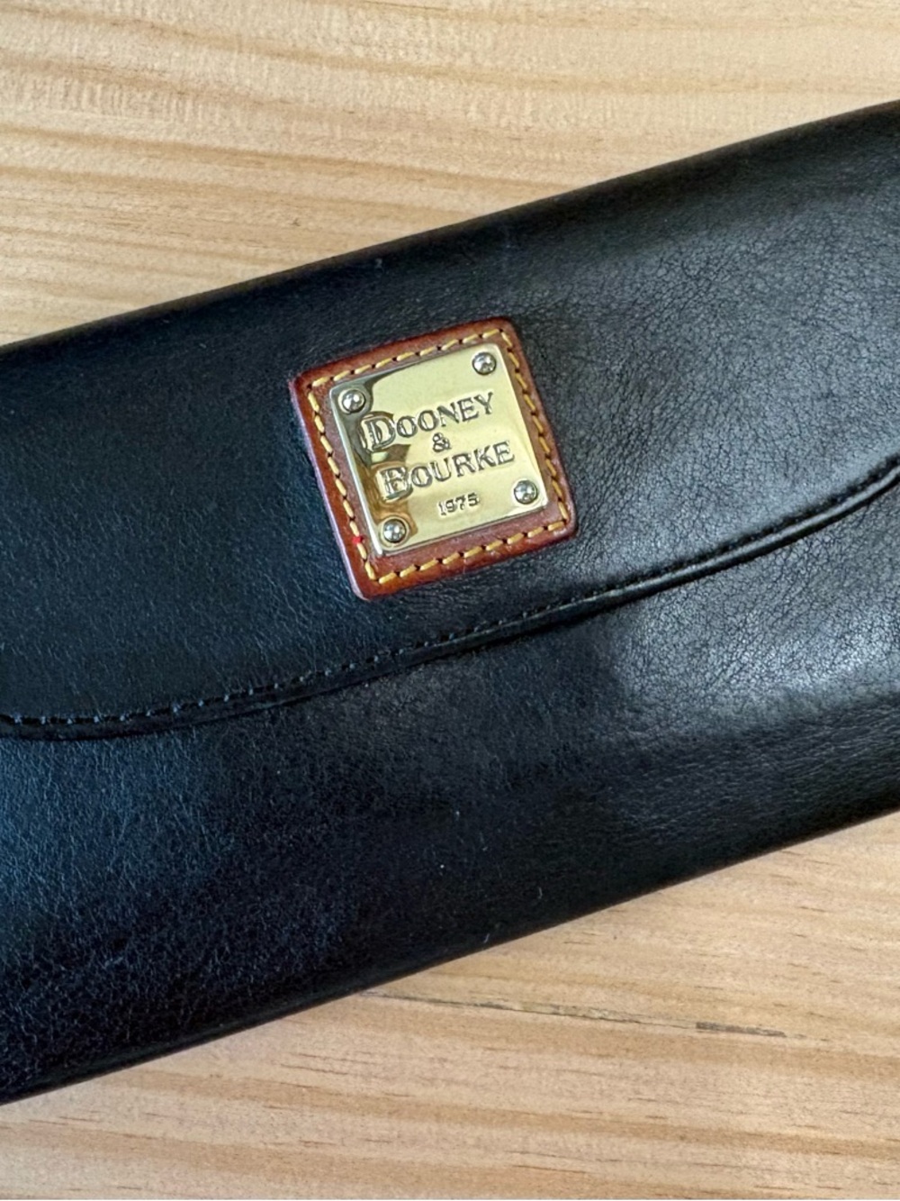 Dooney & Bourke Black Leather Wallet with Brass Logo Plaque